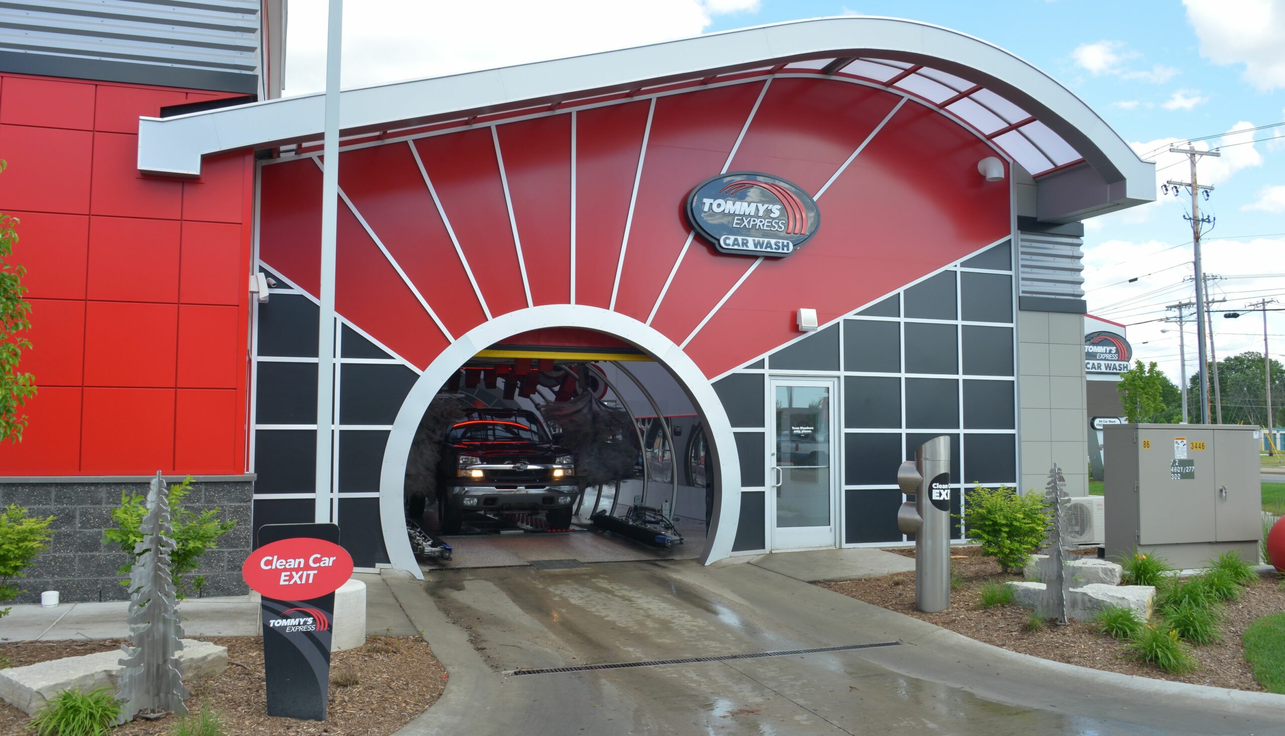 A car emerging from a Tommy's Express Car Wash