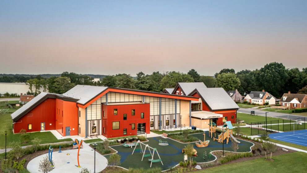 A rendering of the TB Smith Community Center with a neighborhood beside it.