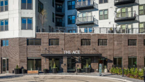 The main doorway of The Ace with a large white sign that says The Ace