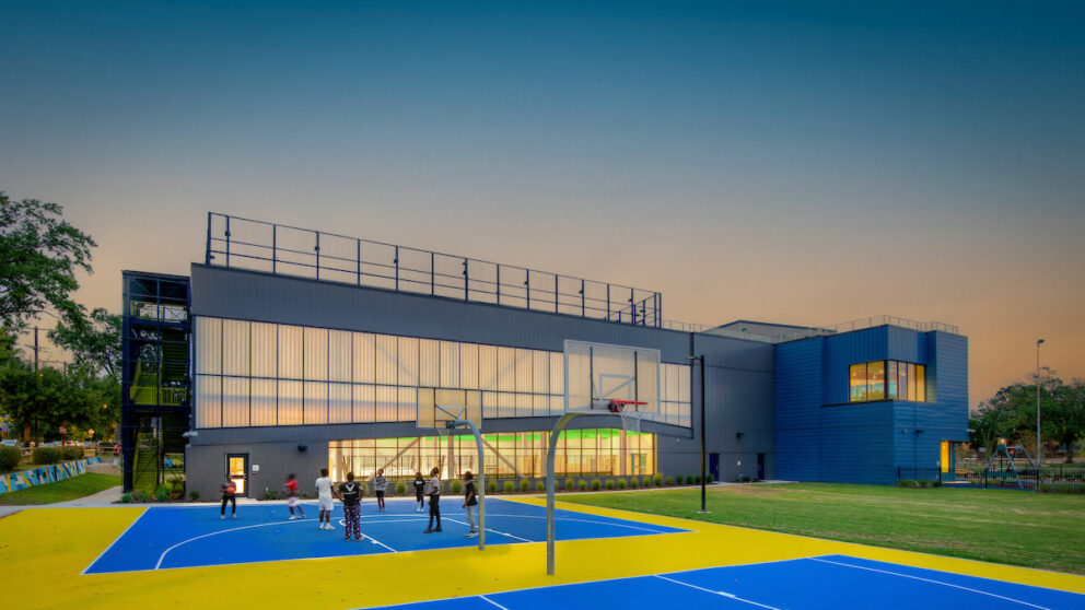 A rendering of the basketball court outside of the Lucks Field Community Center at sunset.