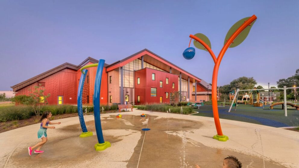 A rendering of the water play area with the TB Smith Community Center in the background.