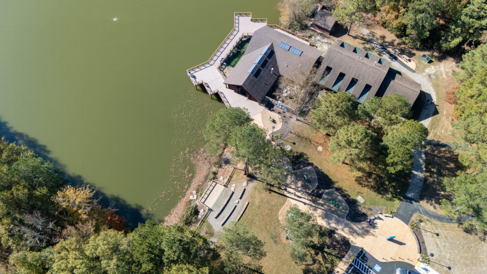 A bird's eye view of the Three Lakes Park on the water.